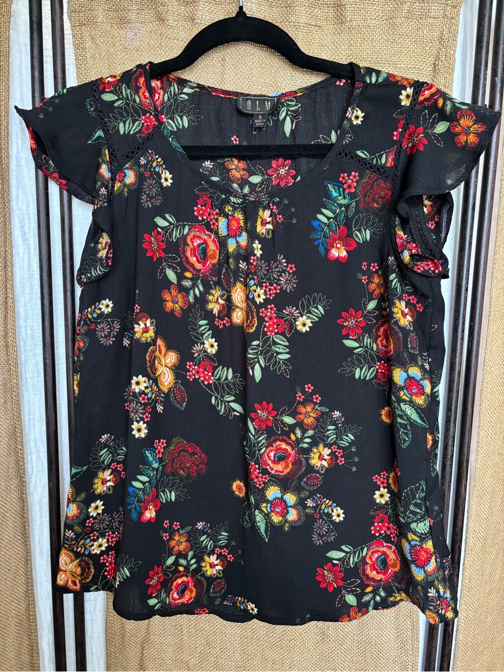 Black Floral Ruffled Shoulder Blouse by OLM